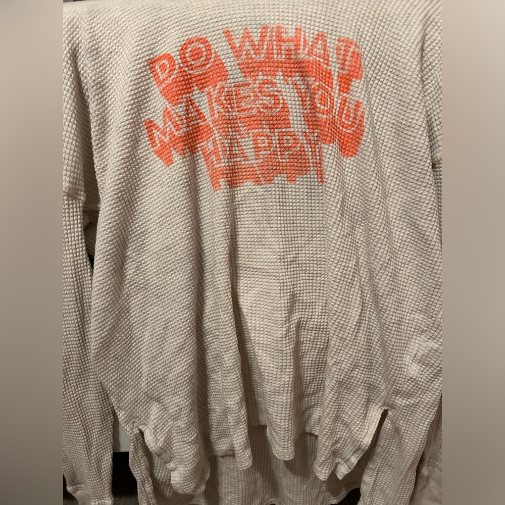 Cute long sleeve with thumb holes with orange pinkish wording and waffle texture